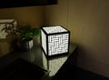 300mm metal cube lamp featuring anbasket weave cut-out pattern, white plexiglass panels, and a textured black finish.