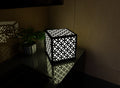 300mm metal cube lamp featuring a circle mosaic cut-out pattern, white plexiglass panels, and a textured black finish.