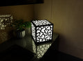 300mm metal cube lamp featuring a coral cut-out pattern, white plexiglass panels, and a textured black finish.