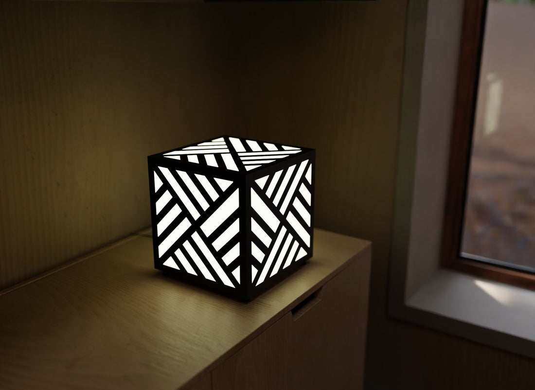 300mm metal cube lamp featuring a diagonal weave cut-out pattern, white plexiglass panels, and a textured black finish.