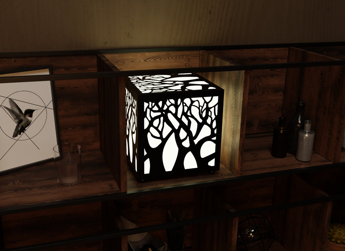 300mm metal cube lamp featuring a enchanted forest cut-out pattern, white plexiglass panels, and a textured black finish.