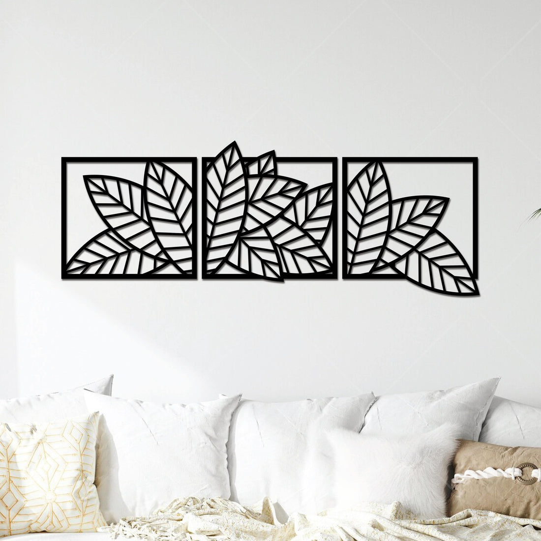 High-quality metal wall art featuring the "The Hojas Trifecta Metal Wall Art" crafted from durable steel with a sleek black powder-coated finish.