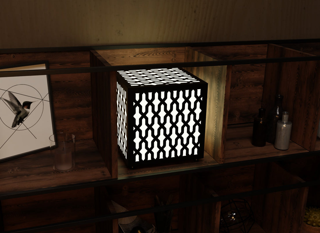 300mm metal cube lamp featuring an interlocking cut-out pattern, white plexiglass panels, and a textured black finish.