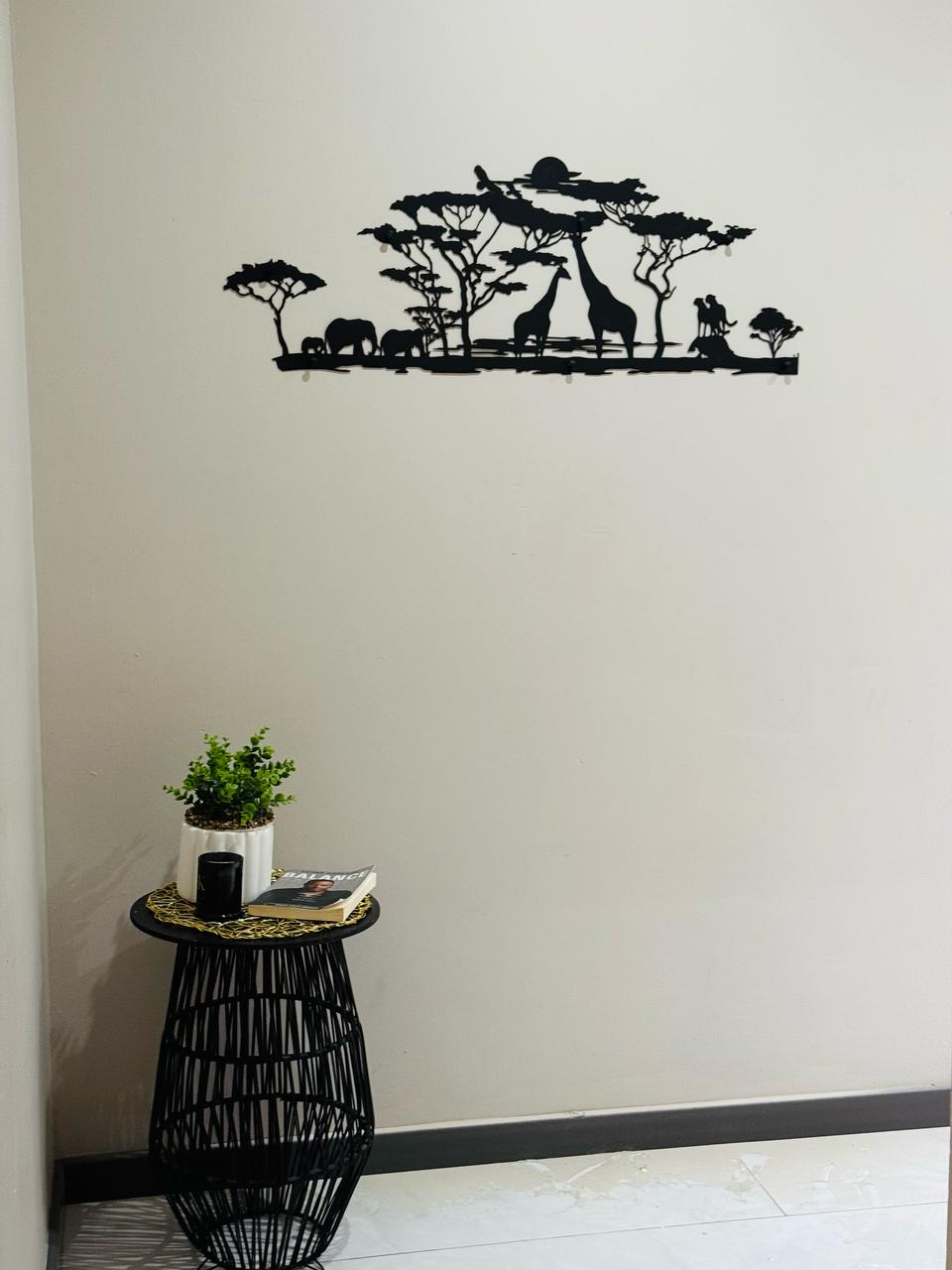 A black metal wall art design depicting the beauty of African wildlife, featuring some of the big 5.