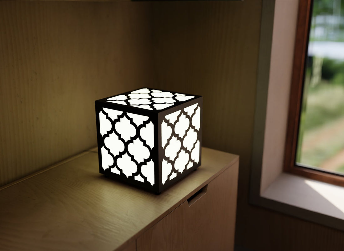300mm metal cube lamp featuring a Moroccan trellis cut-out pattern, white plexiglass panels, and a textured black finish.
