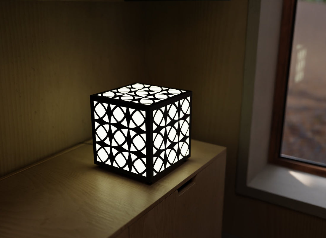 300mm metal cube lamp featuring an orb grid cut-out pattern, white plexiglass panels, and a textured black finish.