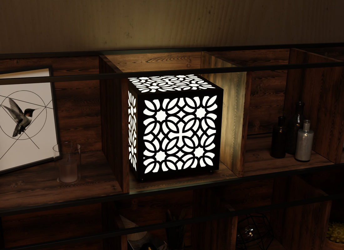 300mm metal cube lamp featuring a petal lace grid cut-out pattern, white plexiglass panels, and a textured black finish.