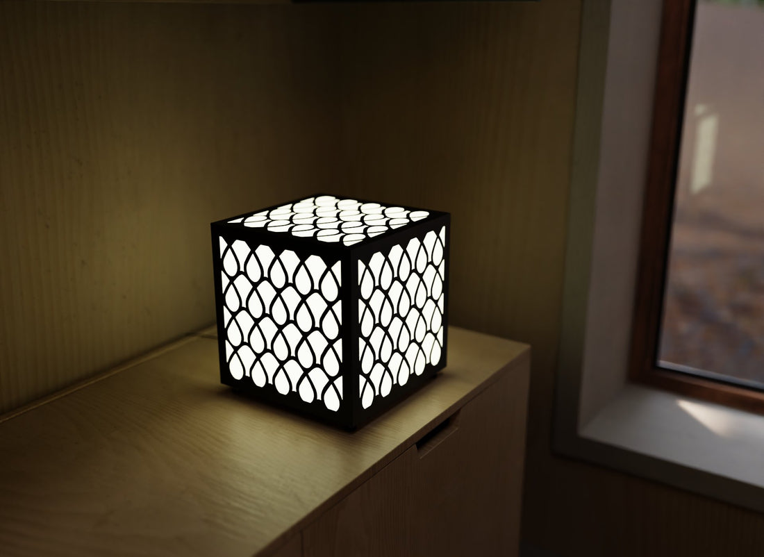 300mm metal cube lamp featuring a raindrop cut-out pattern, white plexiglass panels, and a textured black finish.