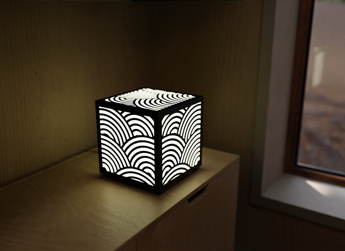 300mm metal cube lamp featuring a rolling wave cut-out pattern, white plexiglass panels, and a textured black finish.