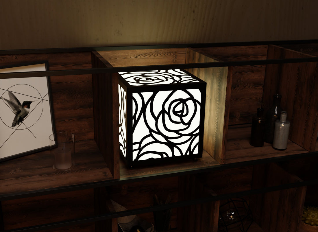 300mm metal cube lamp featuring a blooming rose cut-out pattern, white plexiglass panels, and a textured black finish.