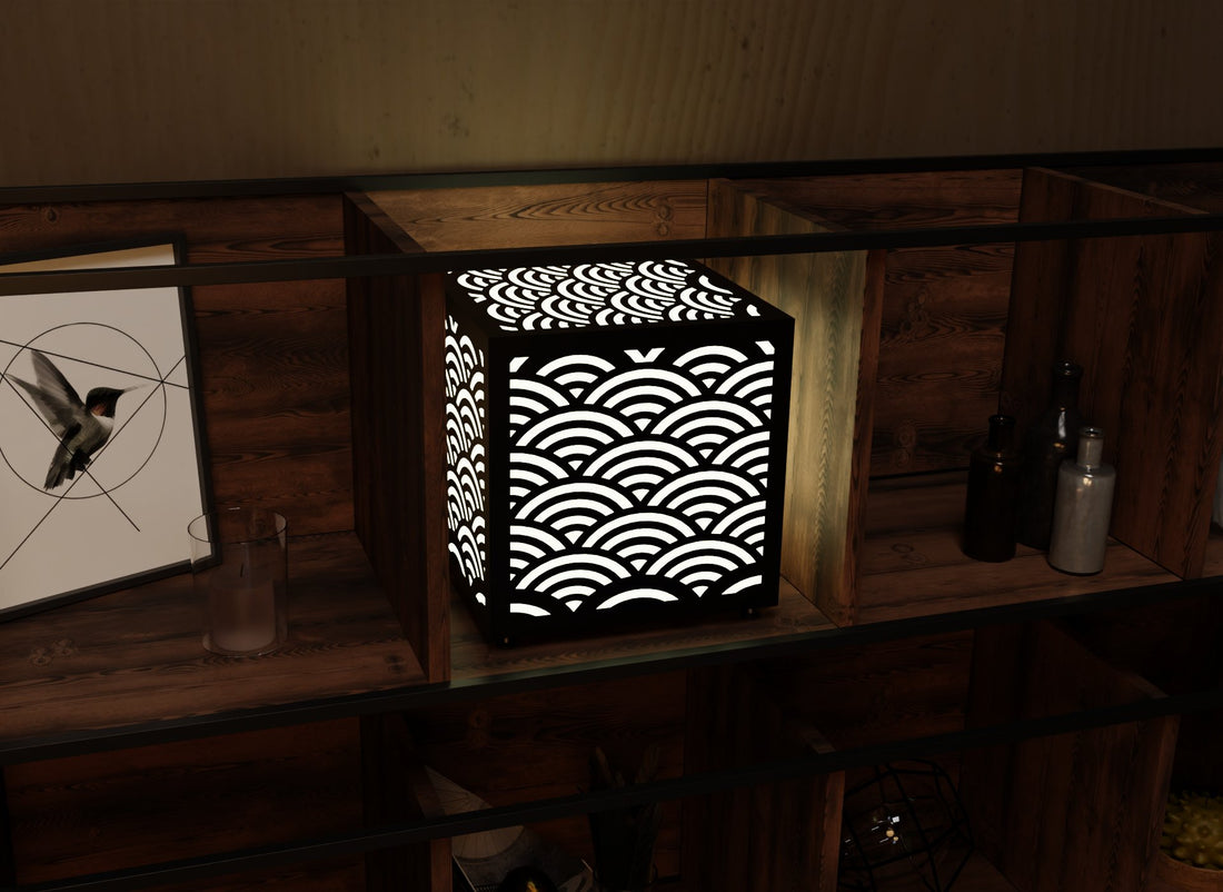 300mm metal cube lamp featuring a seaside wave cut-out pattern, white plexiglass panels, and a textured black finish.