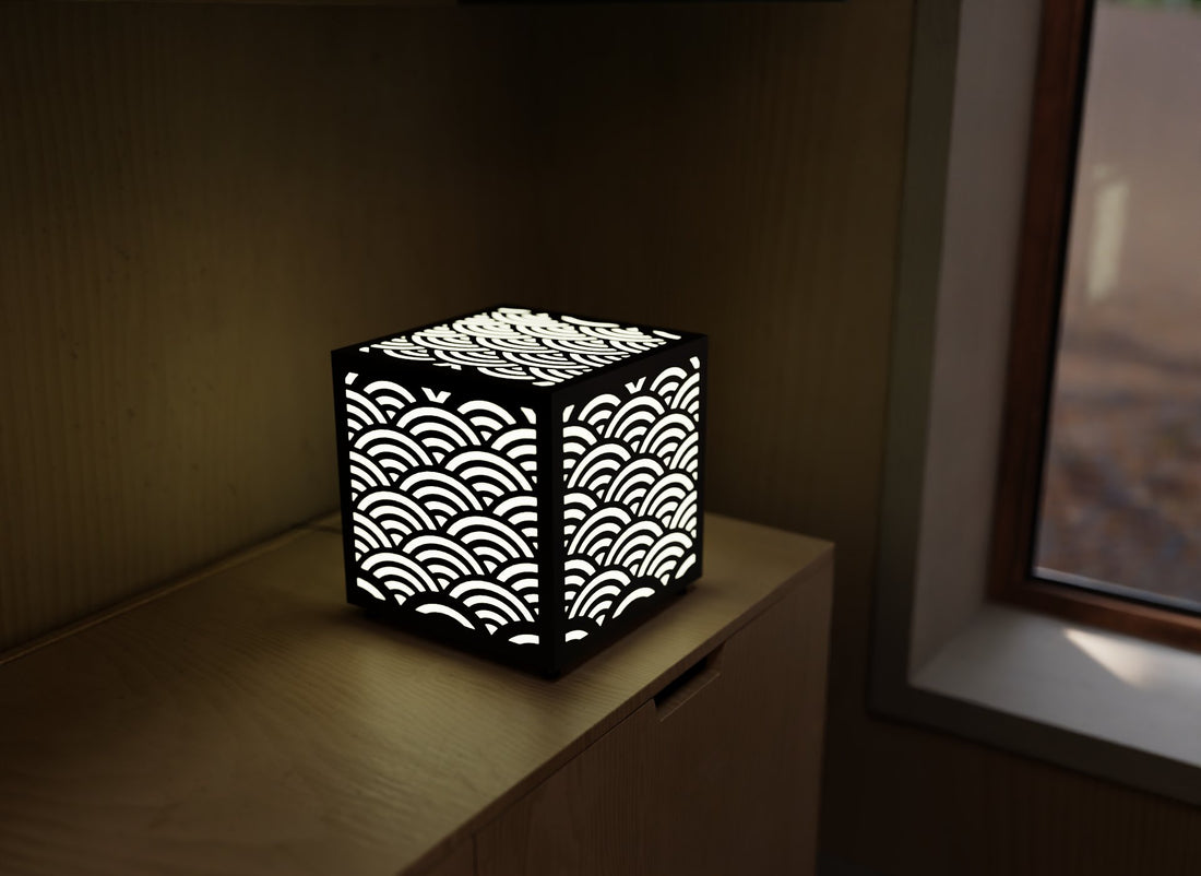 300mm metal cube lamp featuring a seaside wave cut-out pattern, white plexiglass panels, and a textured black finish.