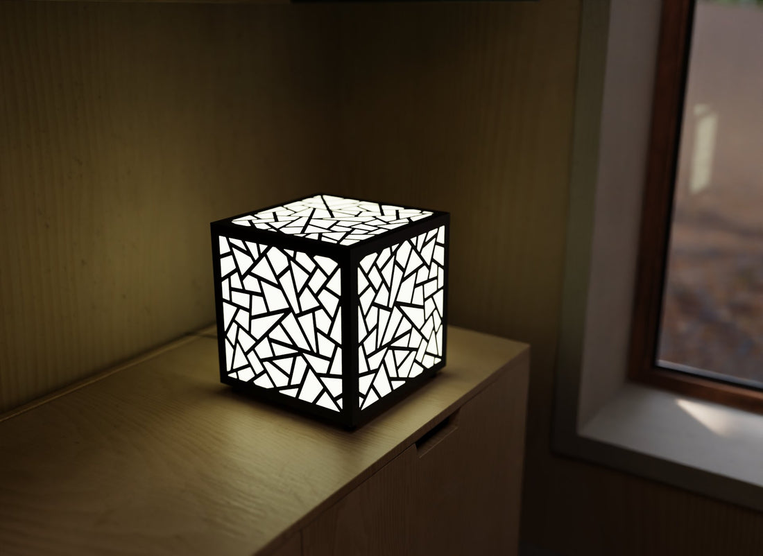 300mm metal cube lamp featuring a shattered mosaic cut-out pattern, white plexiglass panels, and a textured black finish.