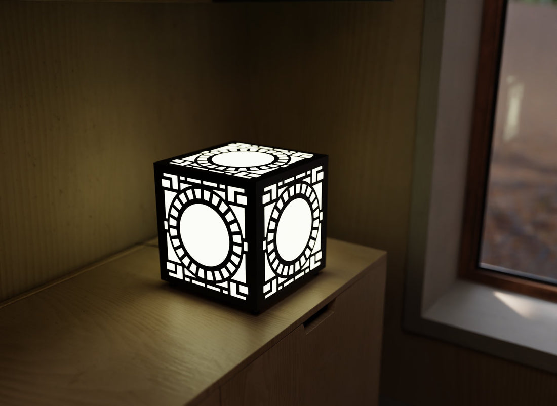 300mm metal cube lamp featuring a solar portal cut-out pattern, white plexiglass panels, and a textured black finish.