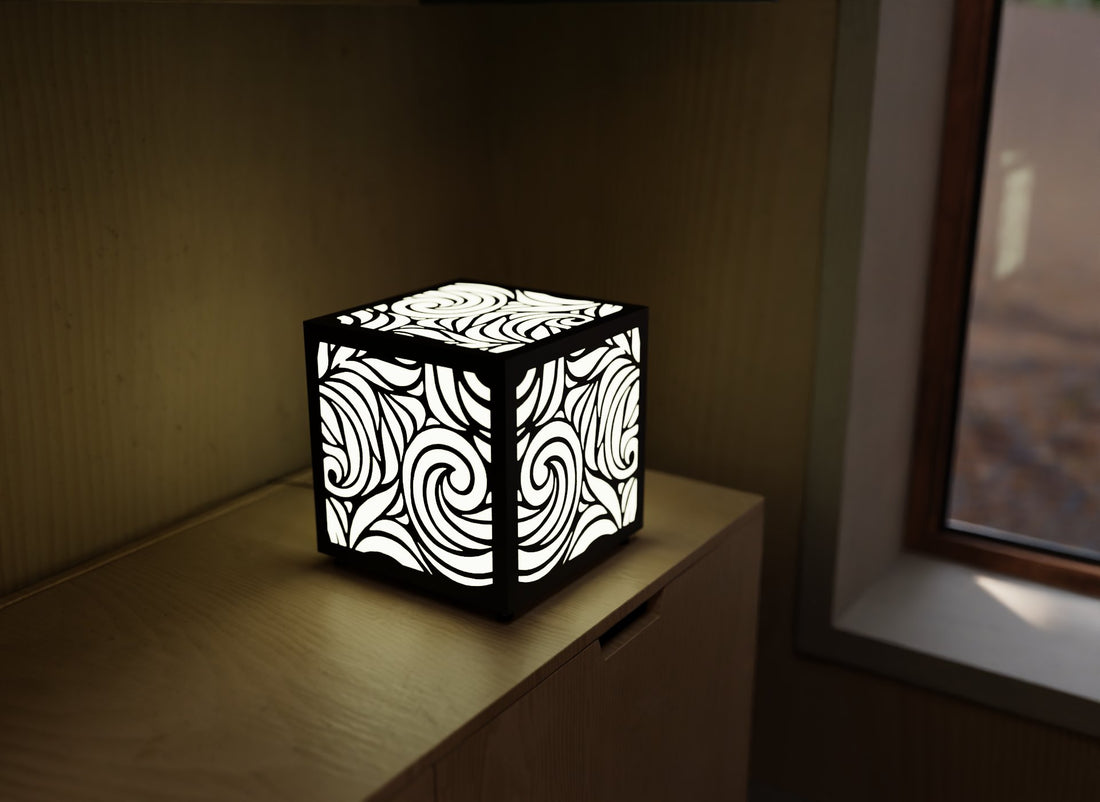 300mm metal cube lamp featuring a swirl breeze cut-out pattern, white plexiglass panels, and a textured black finish.