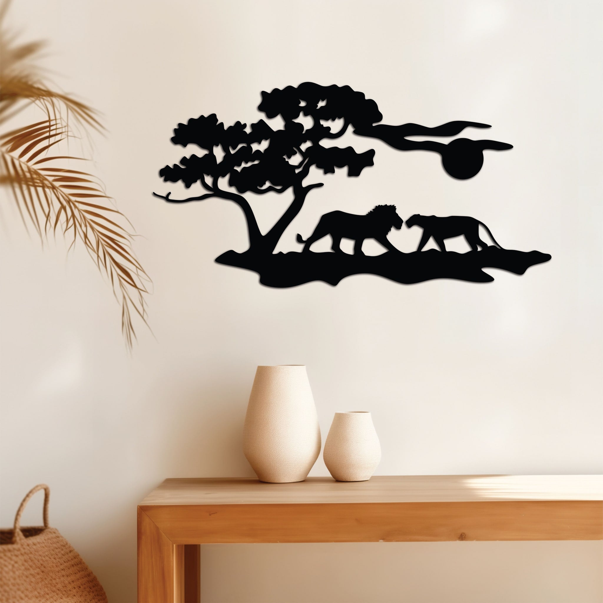 Wide metal wall art depicting two lions relaxing in the vivid sunset in the background, adding elegance to a warm-toned room.