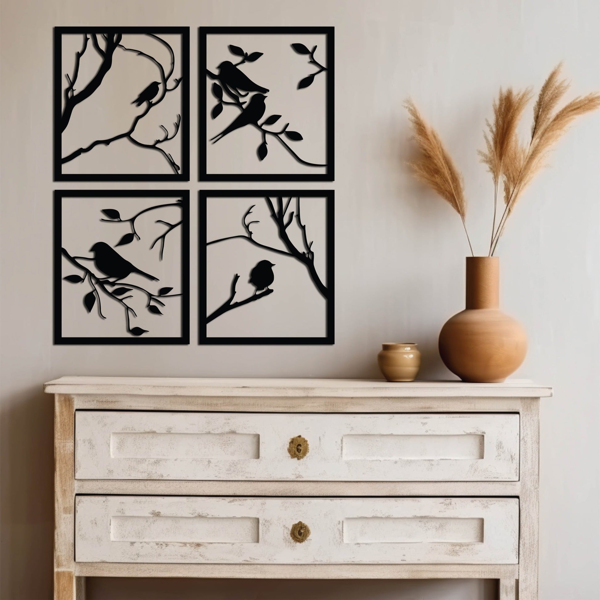 A set of four square metal wall art panels, each featuring a bird in a unique pose. The panels are designed to be arranged into a larger square, creating a unified and artistic composition.