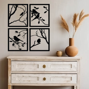 A set of four square metal wall art panels, each featuring a bird in a unique pose. The panels are designed to be arranged into a larger square, creating a unified and artistic composition.