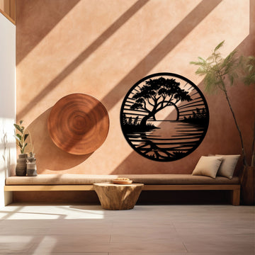 Circular metal wall art showcasing a bonsai tree with a vibrant sunset backdrop, displayed in a serene living space with soft tones.