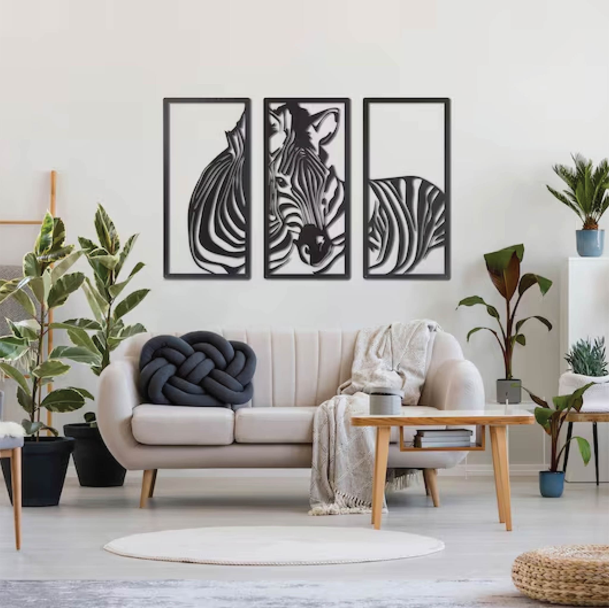 Zebra-themed metal wall art split into three frames, featuring a bold and modern design ideal for nature lovers.