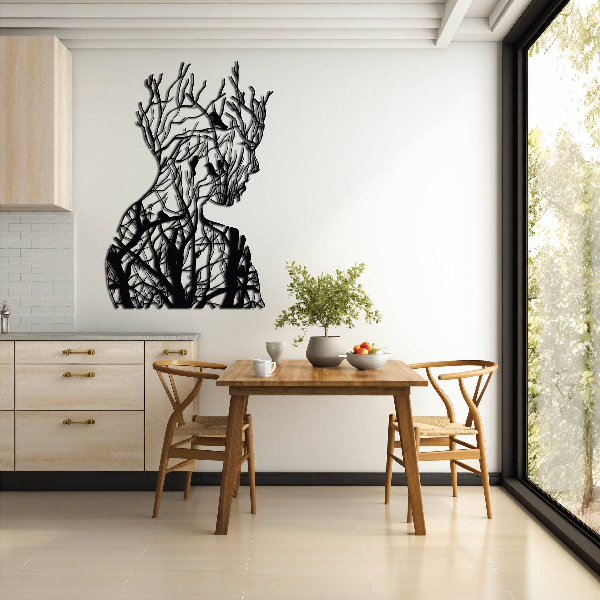 A black metal wall art silhouette of a human face intricately merged with tree branches, creating a fusion of nature and human form.