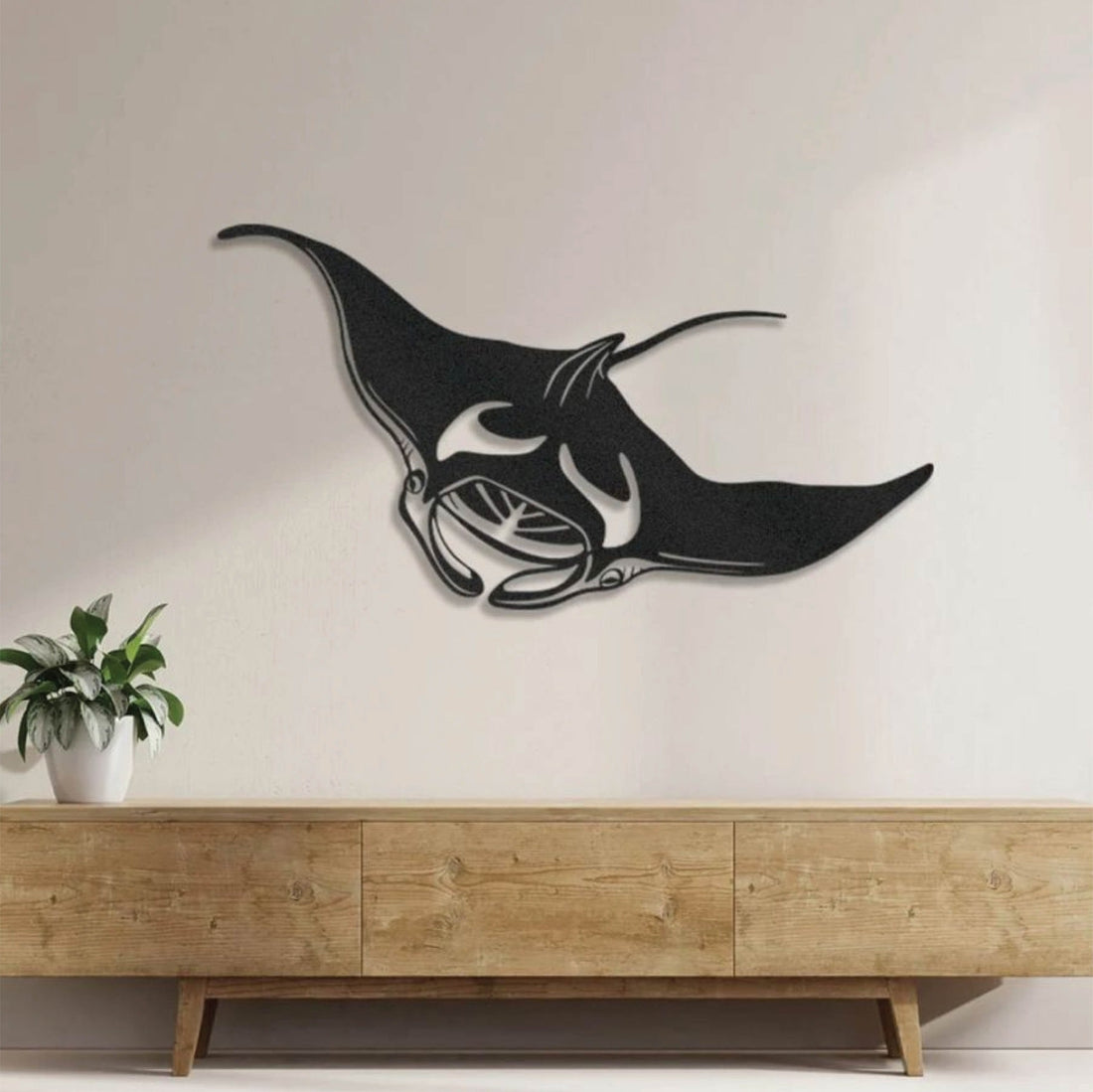 Metal manta ray wall art featuring an elegant and fluid design, perfect for coastal and ocean-inspired decor.