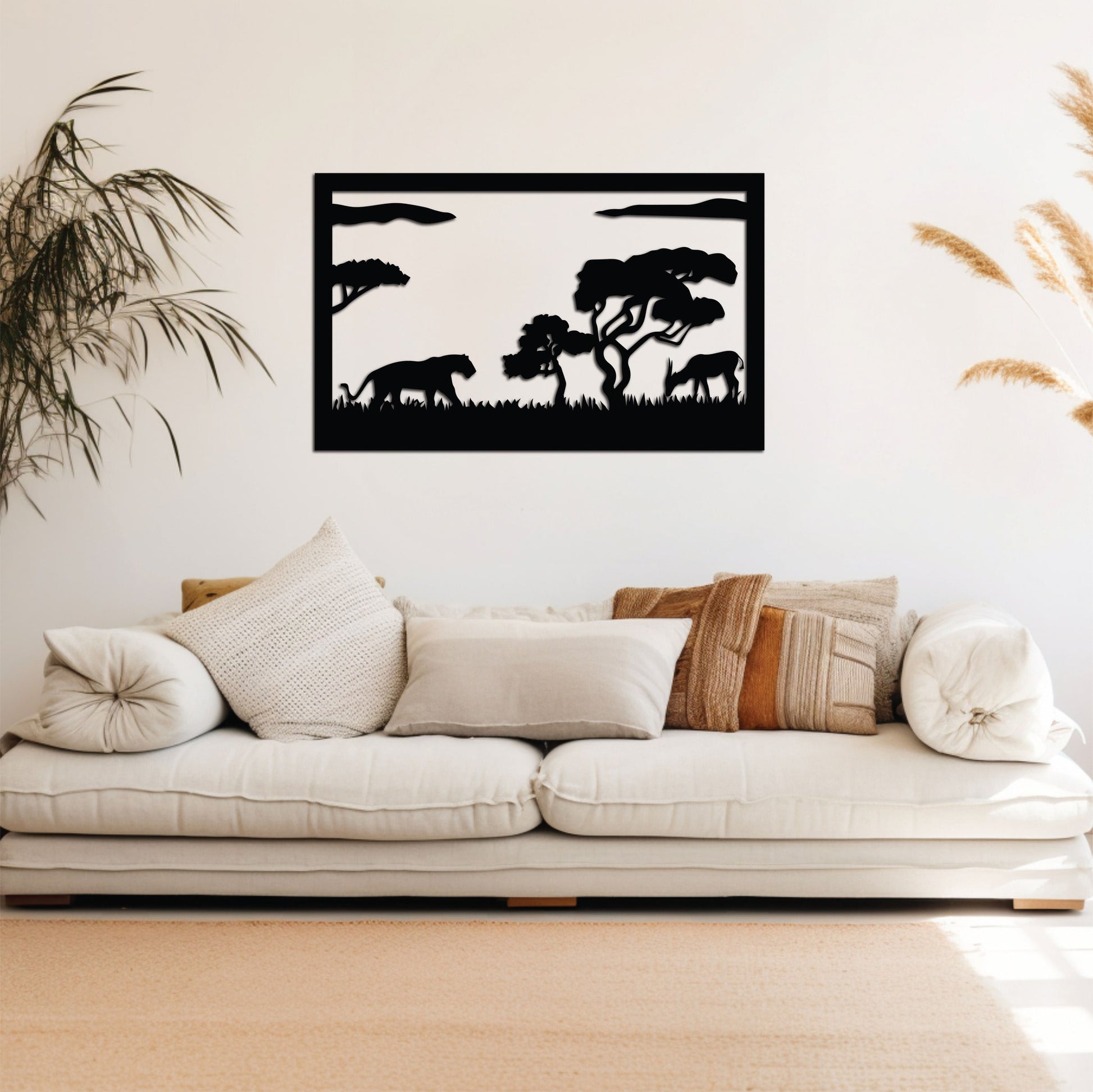 A black metal wall art design capturing the dramatic moment of a lion stealthily stalking a deer.