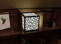 300mm metal cube lamp featuring a shattered mosaic cut-out pattern, white plexiglass panels, and a textured black finish.