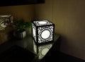 300mm metal cube lamp featuring a solar portal cut-out pattern, white plexiglass panels, and a textured black finish.