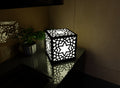 300mm metal cube lamp featuring a starburst cut-out pattern, white plexiglass panels, and a textured black finish.